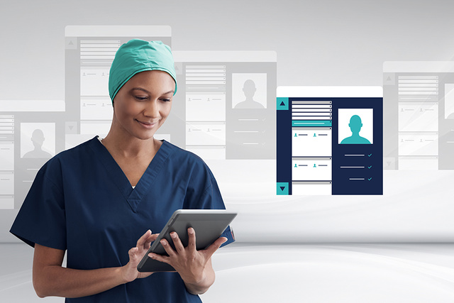 A healthcare professional in scrubs uses a tablet, with digital profiles in the background.