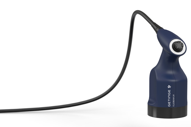 Blue and black handheld device with a cord, labeled GETTIGE, against a white background.