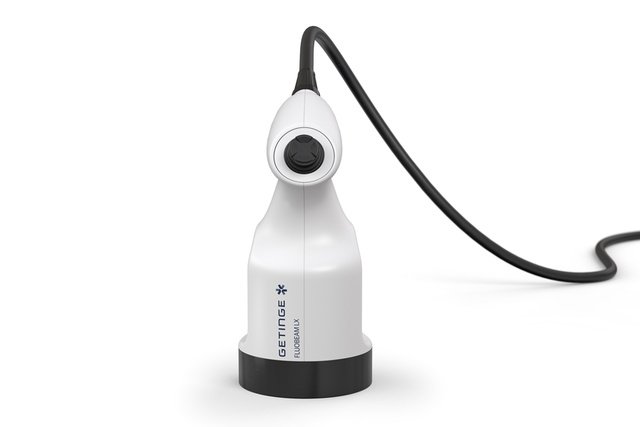 White medical device with a cable, labeled ww5, on a plain background.