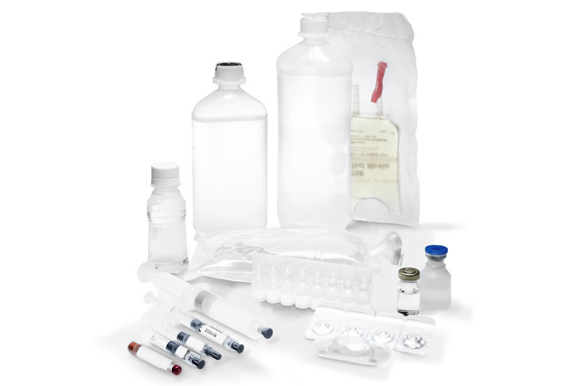 Medical supplies including bottles, syringes, vials, and IV bag on a white background.