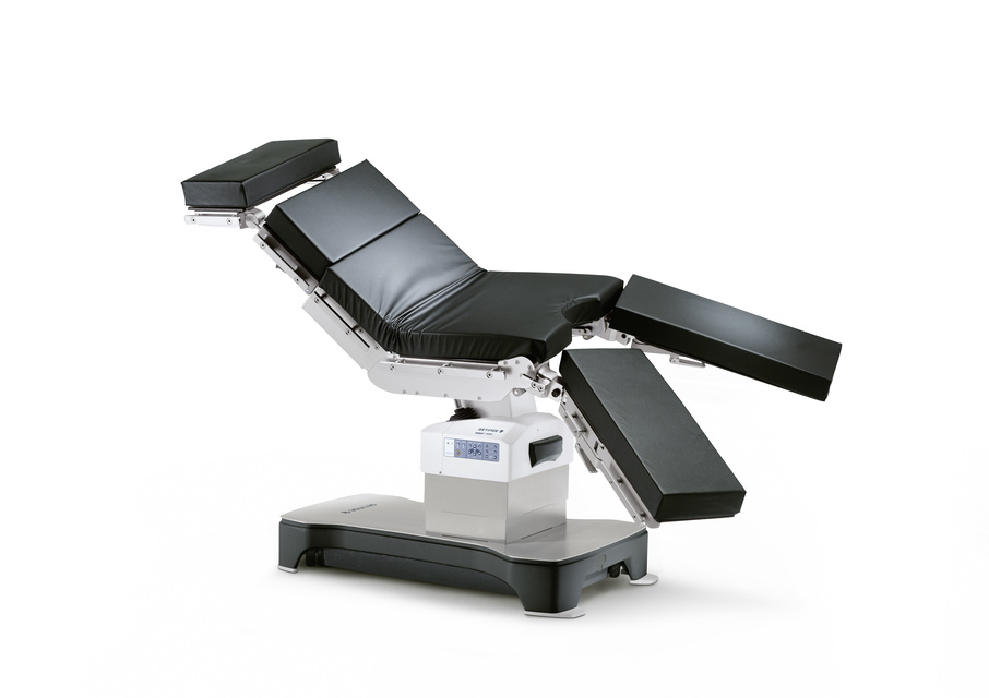 Adjustable black medical examination chair with multiple movable sections on a sturdy base.
