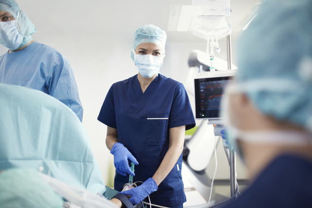 Nurse in hospital, patient monitoring