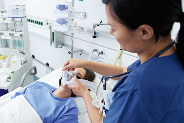 Nurse and patient with Servo-u ventilator